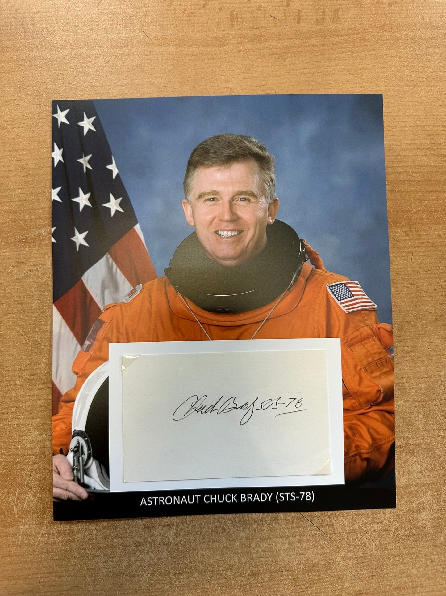 Astronaut Chuck Brady hand-signed 5x3'' index card on 8x10'' presentation