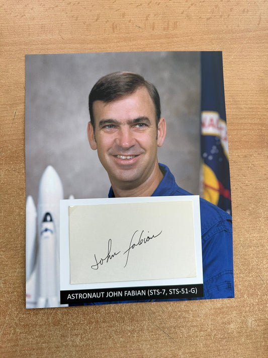 Astronaut John Fabian hand-signed 5x3'' index card on 8x10'' presentation