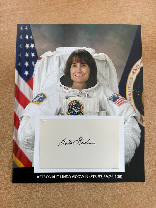 Astronaut Linda Godwin hand-signed 5x3'' index card on 8x10'' presentation