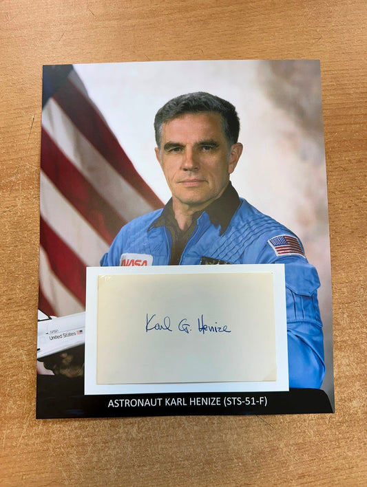 Astronaut Karl Henize hand-signed 5x3'' index card on 8x10'' presentation