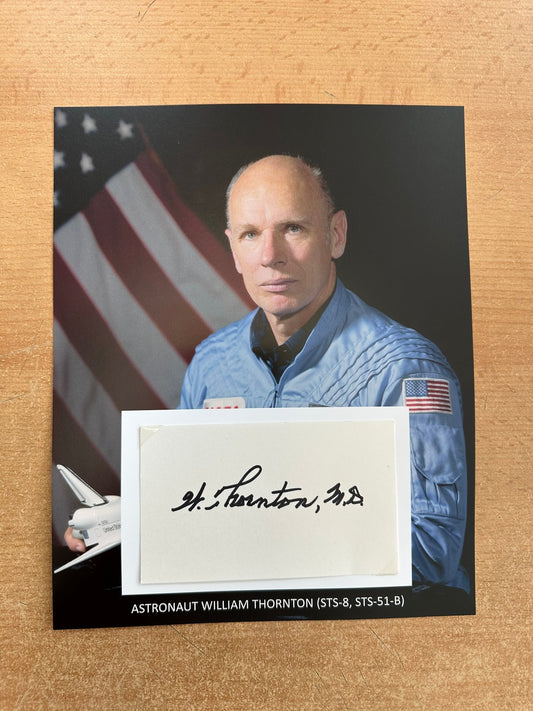 Astronaut William Thornton hand-signed 5x3'' index card on 8x10'' presentation